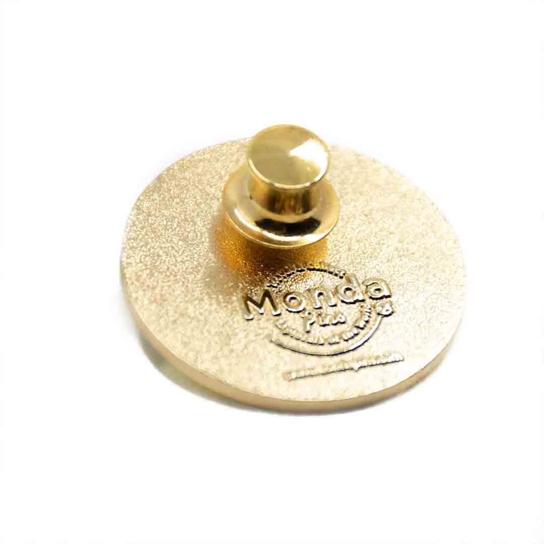 The back side of a Monda Pin, showing the enamel pin backingThe back side of a Monda Pin, showing the enamel pin backing